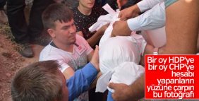 Şehit bebeğini elleriyle kabrine koydu